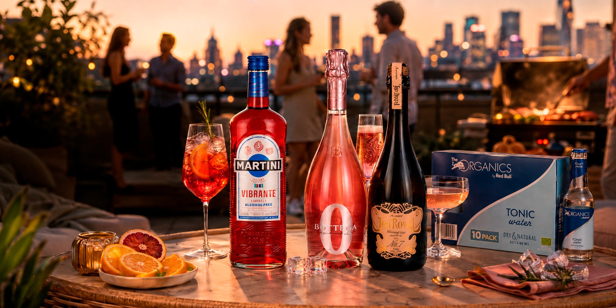 Alcohol-free rooftop drinks with Martini Vibrante, Bottega Zero, Tea Royal sparkling tea and Red Bull Organics Tonic Water on a sunset city terrace.