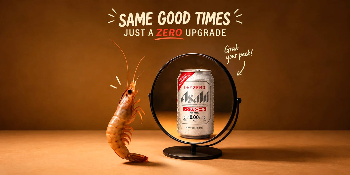Asahi Dry Zero non-alcoholic beer can reflected in a mirror beside a shrimp, with “Same Good Times, Just a Zero Upgrade” text on a warm brown background for a playful zero-alcohol beer promo.