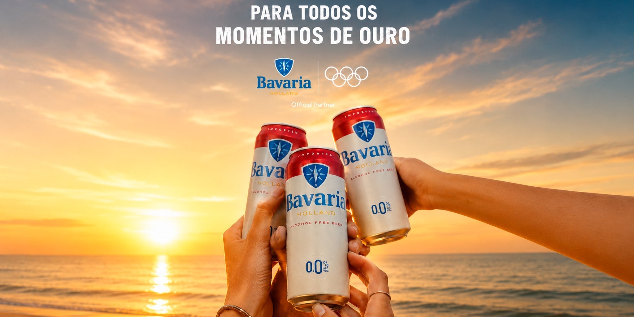 Bavaria 0.0 alcohol-free beer cans raised in a sunset beach toast, styled with warm golden light and ocean view for a refreshing non-alcoholic beer lifestyle image.