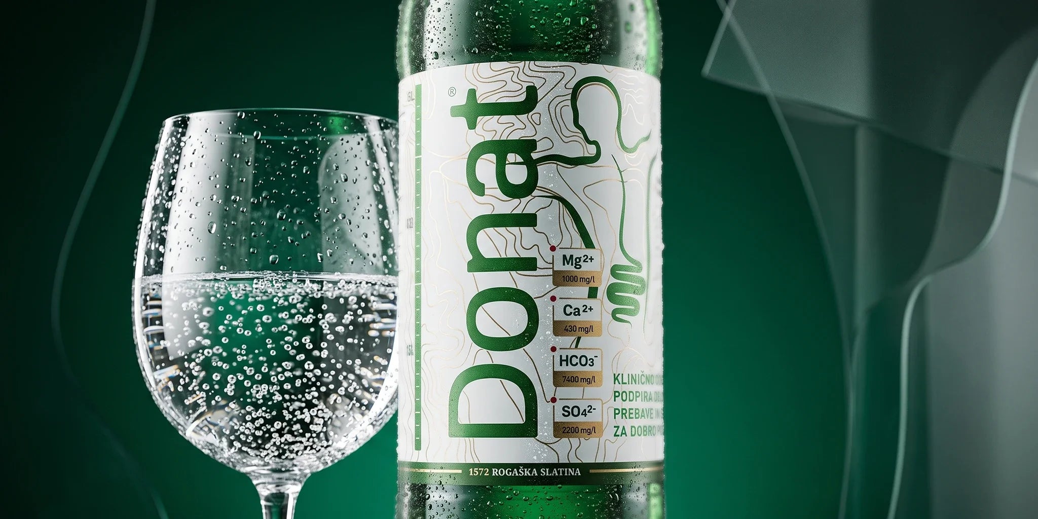 Donat mineral water close-up with sparkling water glass, showing magnesium, calcium, bicarbonate and sulfate mineral content on the label in a clean green wellness setting.