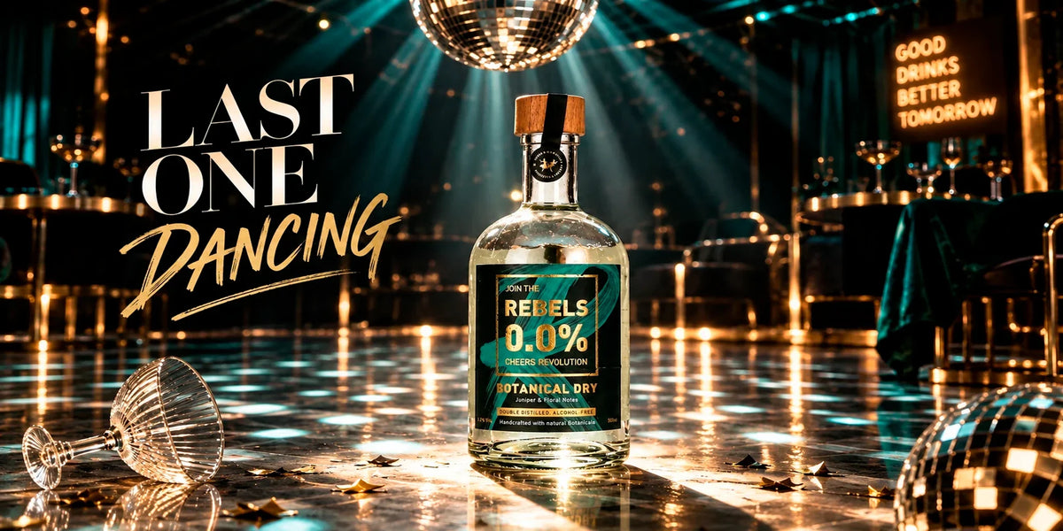 REBELS 0.0 Cheers Revolution Botanical Dry non-alcoholic spirit bottle on an elegant empty dance floor beneath a disco ball, with teal and gold nightclub lighting and a playful “Last One Dancing” party atmosphere.