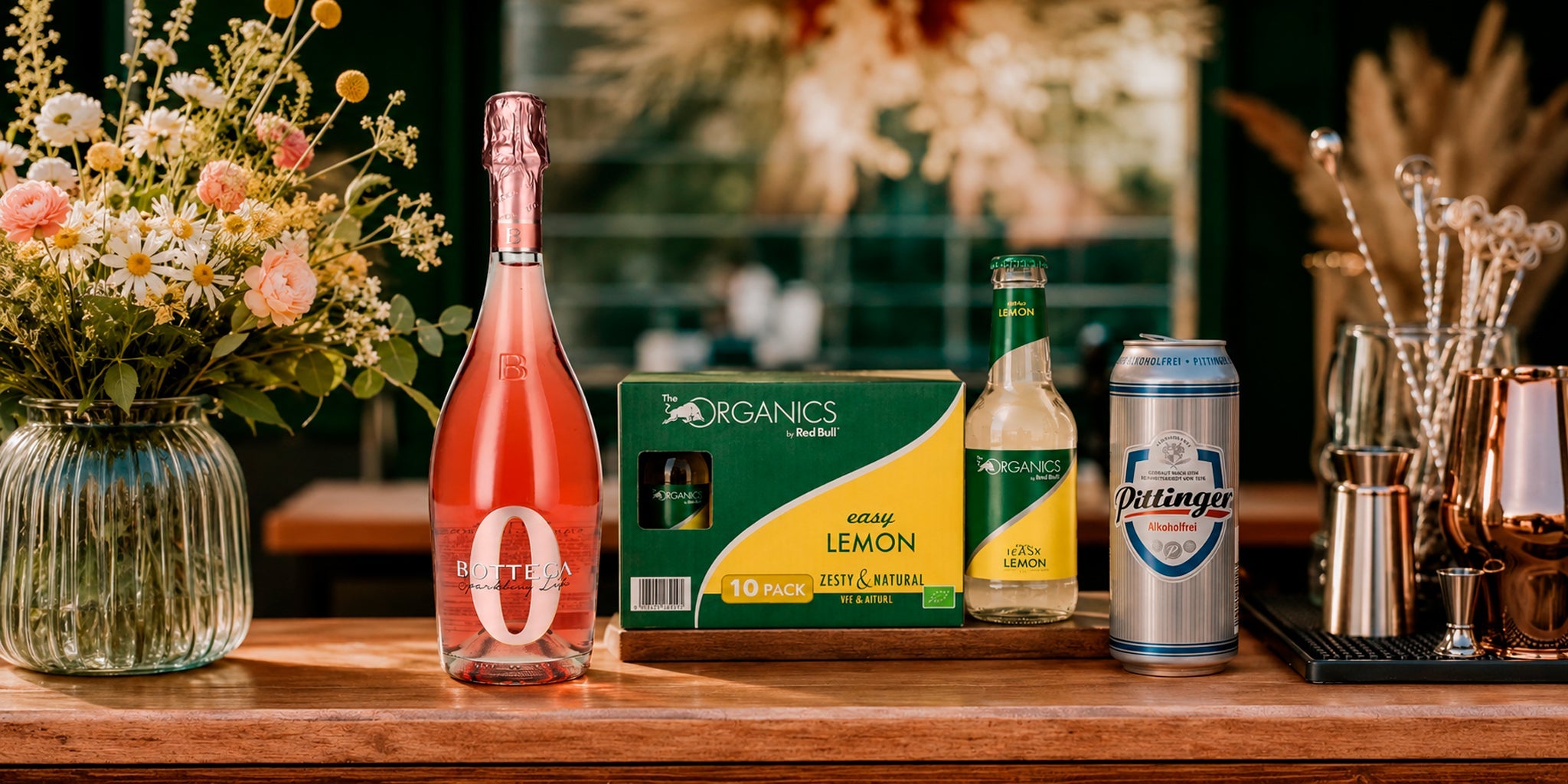 Zero alcohol boat day drinks with Bottega Zero, Red Bull Organics Easy Lemon mixer and Pittiger alcohol-free beer on a stylish bar counter.